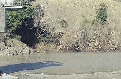 Rocks across from water tower form a deep hole